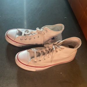 High-top Chuck Taylors, white